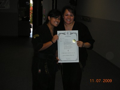 Jessica recieve Jr. Black Belt Certificate
